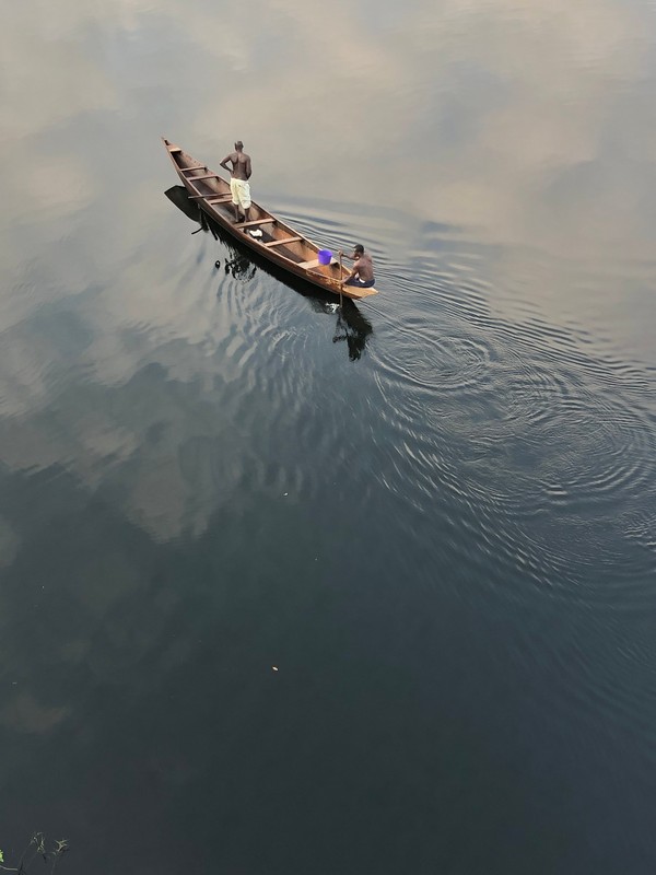 man pissing in lake volta